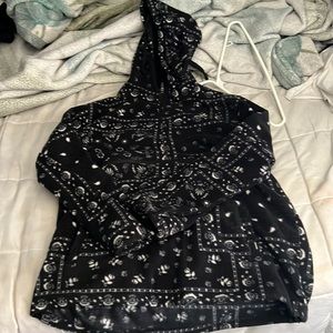 A paisley pattern sweater or A “bandana” style sweater